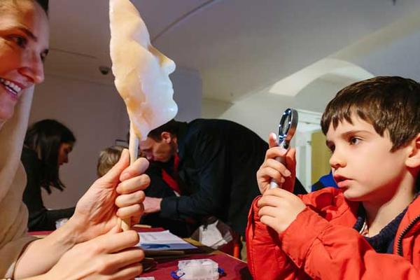 Child engaging in Roman activities